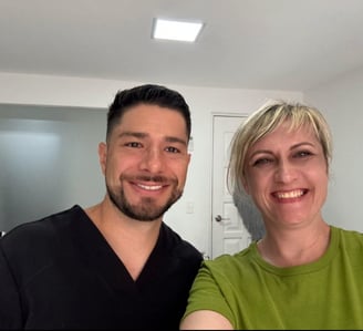 a man and woman standing in dental office Cancun Olya Freiman