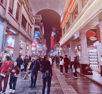 a group of people walking down a street