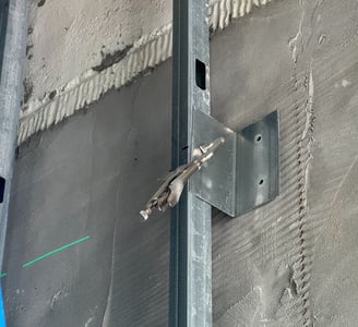 Light-gauge steel stud framing installation in a Washington DC commercial building interior