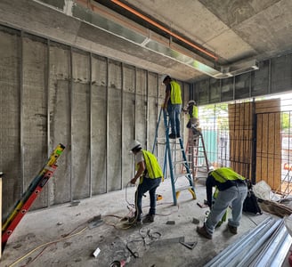 Light-gauge steel stud framing installation in a Washington DC commercial building interior