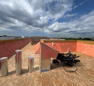 Rooftop framing carpentry with wind bracing for multi-unit residential construction in Washington DC by BBCDC general contrac