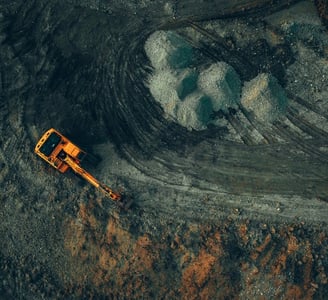 Excavator from above - OreLogic Consulting