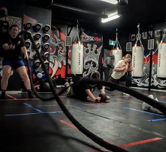 a group of women doing boxing fitness training