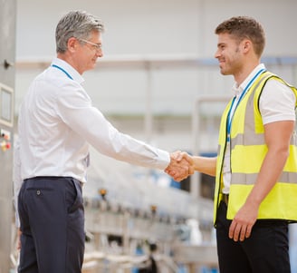 Onandon delivery person shaking hands with customer's executive