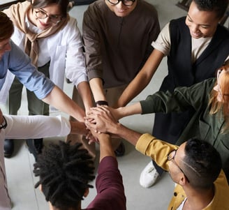 Team putting hands together