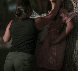 a woman helping te model