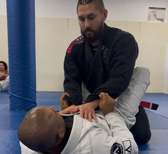 Coach Ruxpin drilling self-defense with training partner