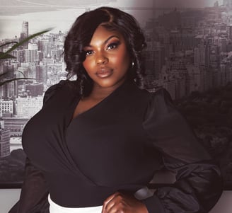 a woman in a black top and white pants