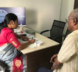 Dr.Shalini Is Consulting Diabetes Patient In Madinaguda Clinic.