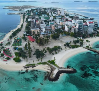 a small island with a small island in the middle of the ocean