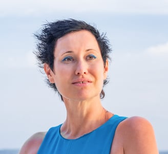 health coach with a blue dress and smile