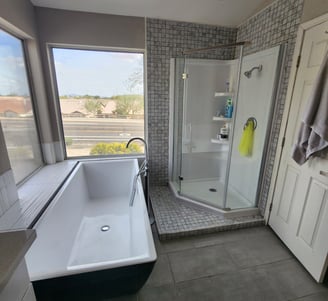 a bathroom with a bathtub and a shower