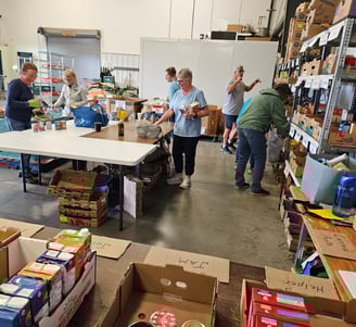 Fort Saskatchewan Food Bank volunteers sort donated food