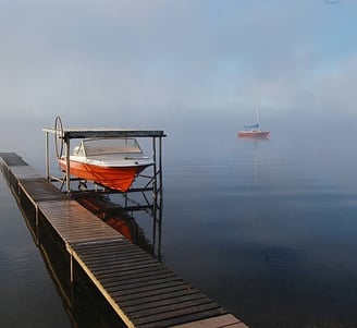 boat lift with red and white boats