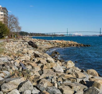 coastal seawall with bridge in horizon