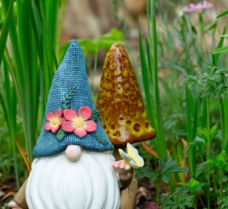 a gnome with a blue hat and a gnome with a blue hat on it
