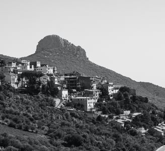 a mountaintop with a view of a mountain range