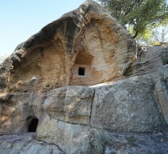 a cave in a cave with a cave in the background