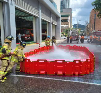 a firefighter is using a hose to put out the hose