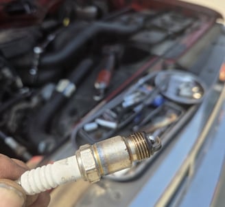 Spark plug that was removed from a 1992 Ford F150 by Fast T's Auto Technician in Waukee Iowa 50263