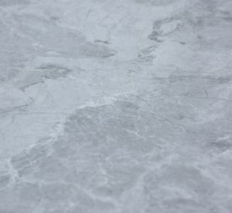 A soft stone slate with intricate gray and silver textures, combining elegance and versatility 