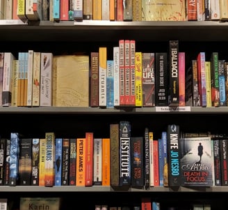 a book shelf with many books on it