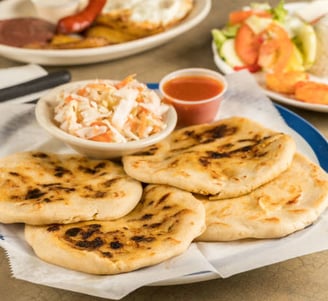 Plate of pupusas with sides