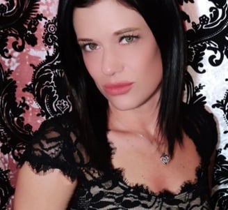 a woman Harley Brooks in a black dress with a black lace top