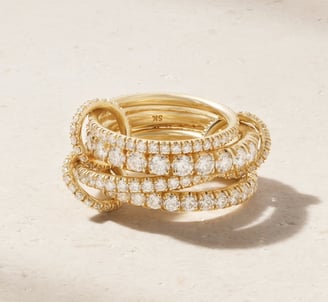 Luxury gold diamond ring with multi-band design, elegant high-end jewelry for timeless style.
