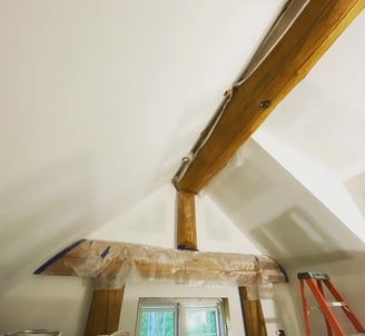 custom log home with freshly sanded drywall and trimtex l-bead