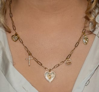 a woman wearing a necklace with a cross on it