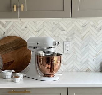 kitchen transformation with herringbone marble backsplash