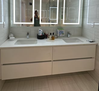 a bathroom with a mirror and a mirror