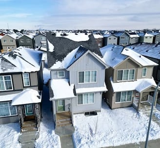 a neighborhood with a lot of snow on the ground