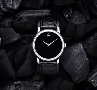 a black and white watch with a black and white watch face