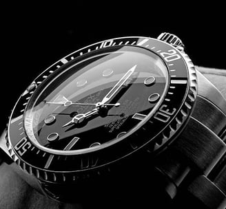 a watch with a black and white photo of a watch