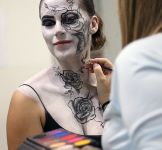 a woman with a face paint painted on her face