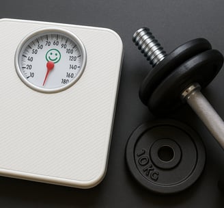 a weight scale and a dumbble