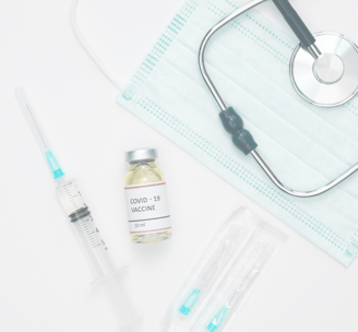 a stethoscope, mask, injection for medical supplies