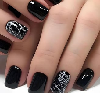 Uñas negras con efecto mármol