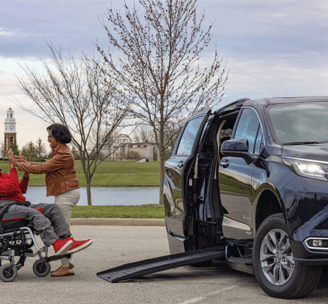 Teenager in a wheelchair getting ready to get in 