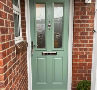 a new chartwell green l front door on red brick house installed by buildmydoor