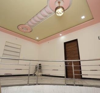 a circular staircase with a chandelier and a chandelier