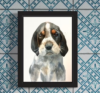 a custom watercolor portrait of a dog in a black frame