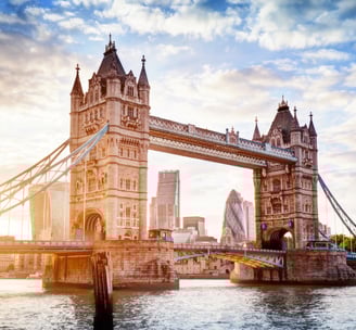 a bridge spanning the river with a bridge in the background