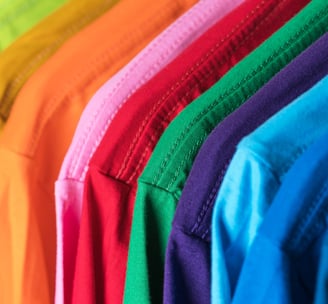 My Happy Place Crafts LLC | Clothing rack of plain colorful t-shirts