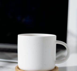 My Happy Place Crafts LLC | Plain, white, ceramic coffee mug next to laptop