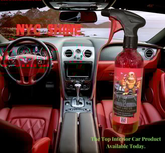 a bottle of wine in a car with a bottle of wine in the background