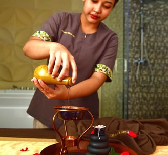 martha tilaar therapist pouring massage oils