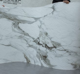 Luxurious Calacatta soft stone with unique, bold patterns and a bright white surface